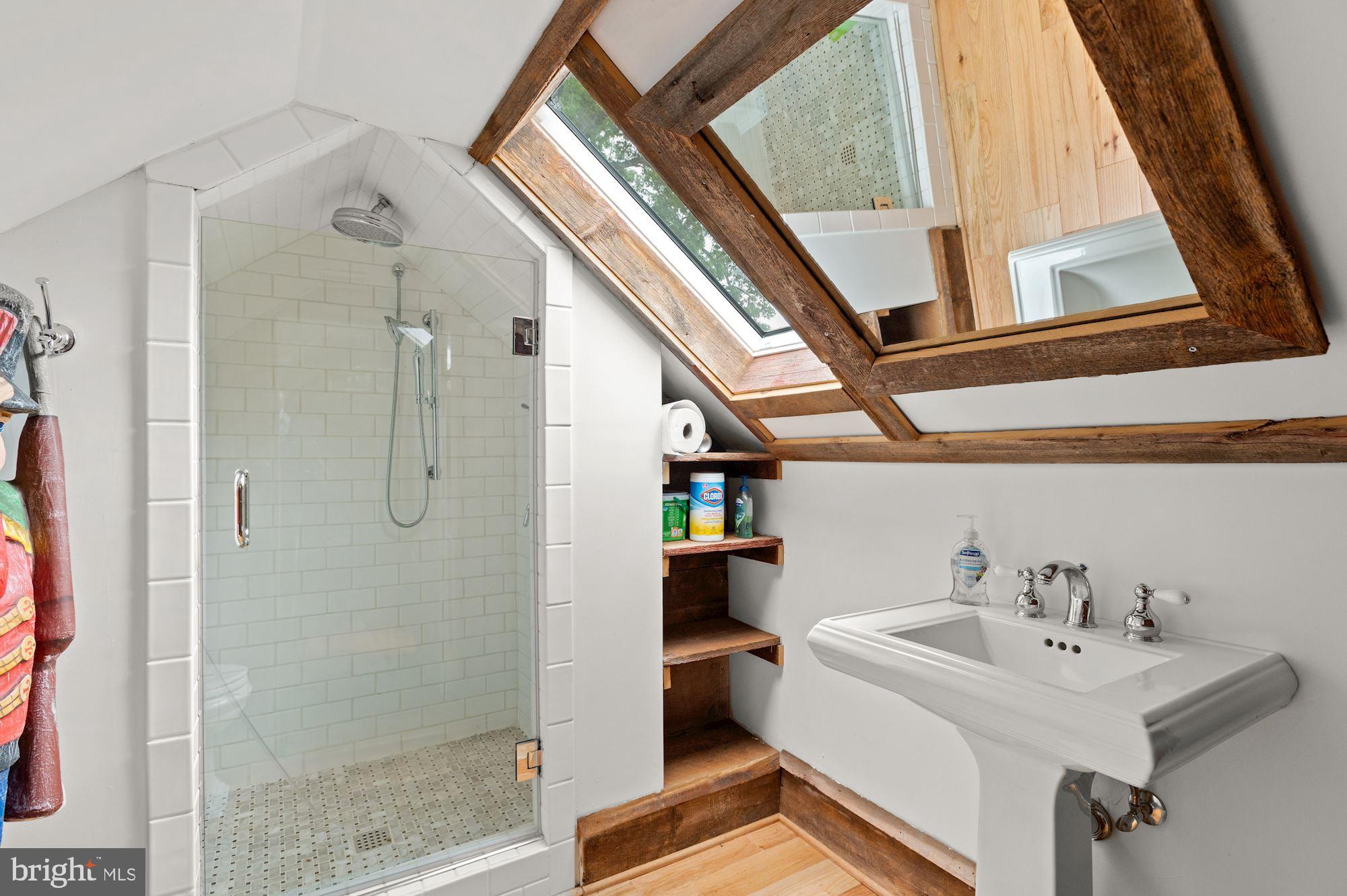 1101 Chain Bridge Road McLean, VA 22101 - Photo 39 of 54 a bathroom with a sink and a mirror