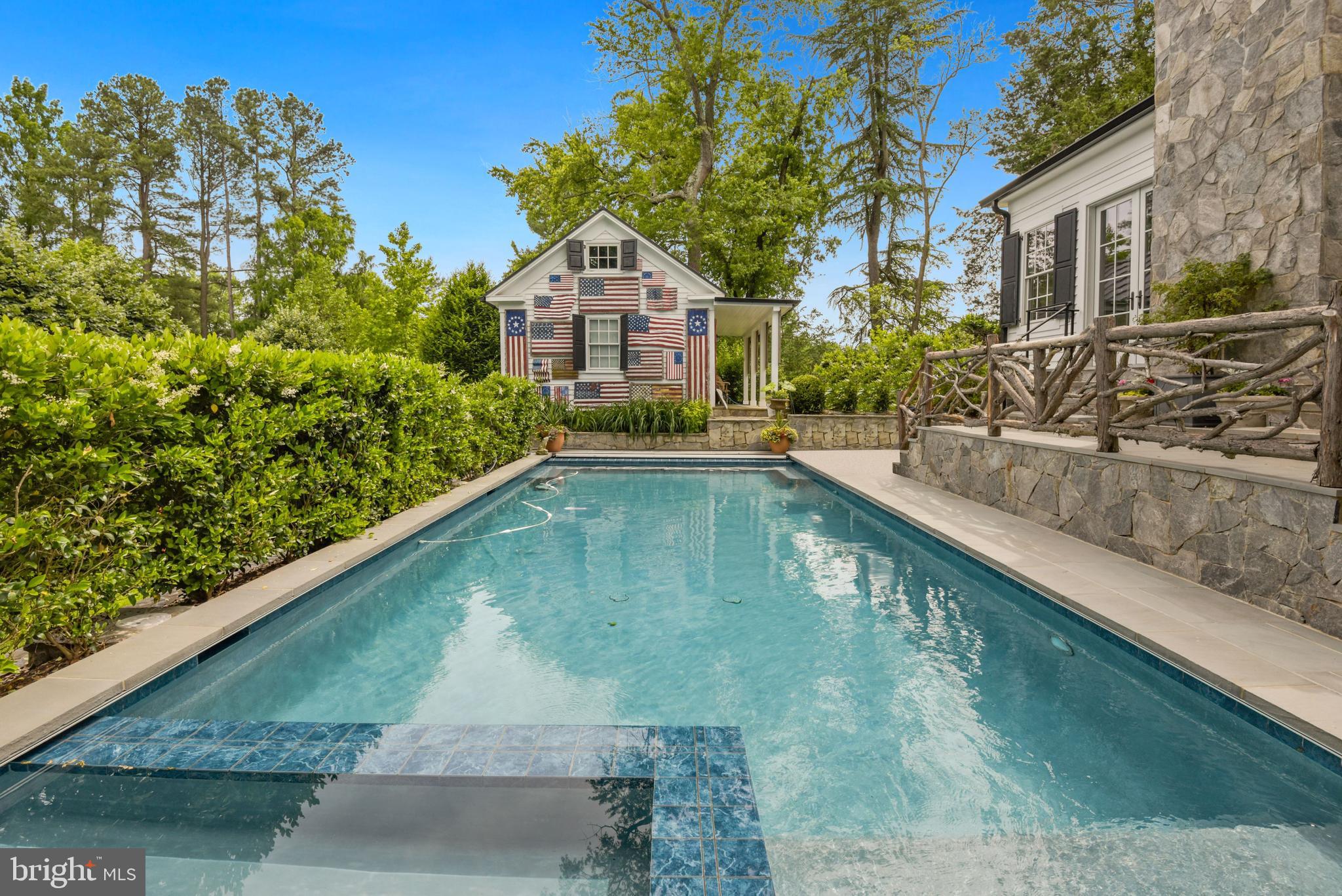 1101 Chain Bridge Road McLean, VA 22101 - Photo 43 of 54 a view of a house with swimming pool