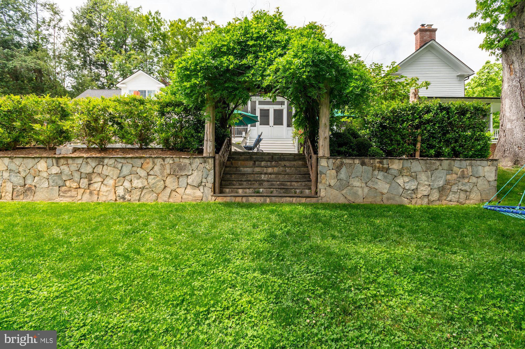 1101 Chain Bridge Road McLean, VA 22101 - Photo 46 of 54 a front view of house with a garden