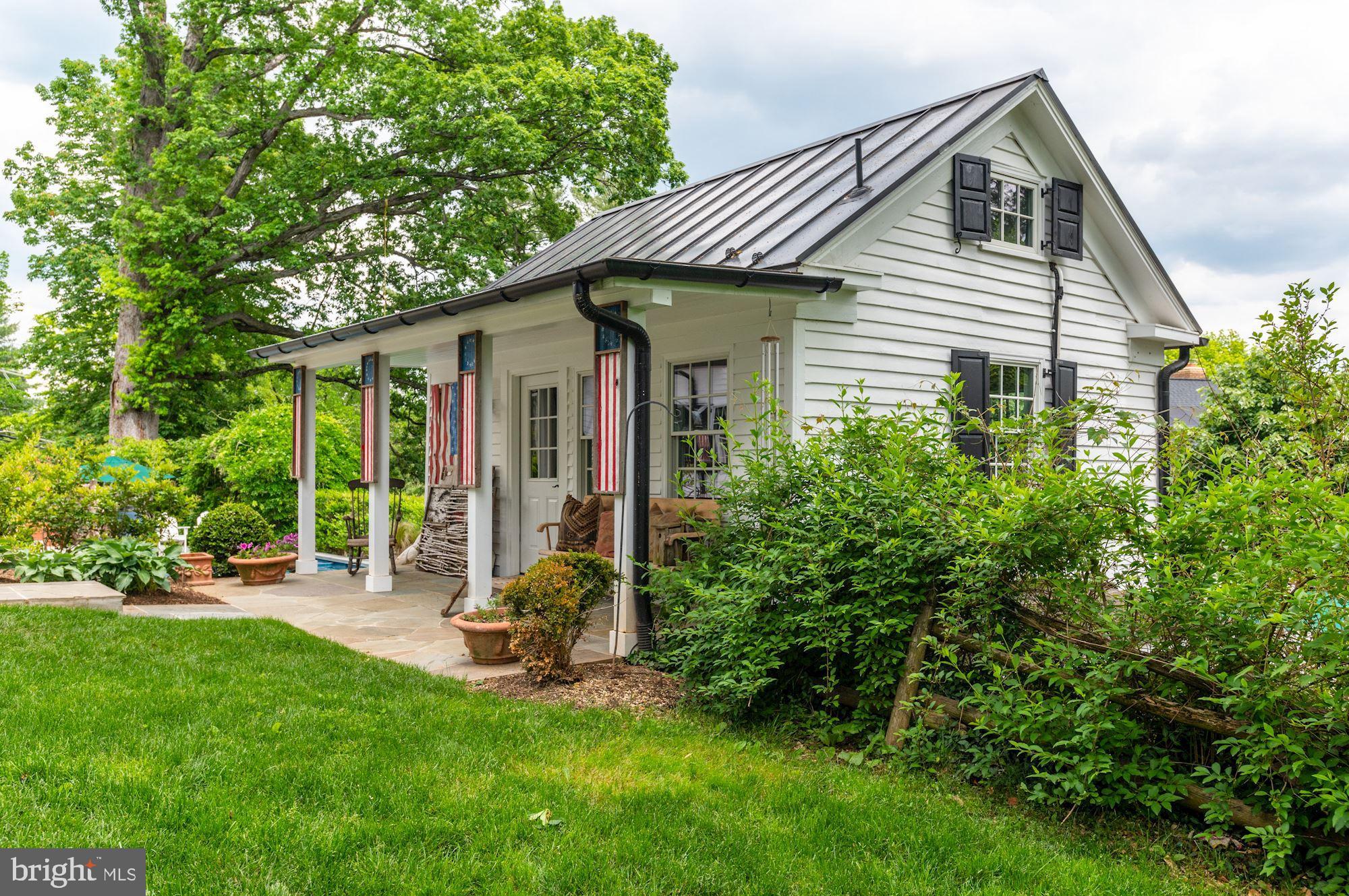 1101 Chain Bridge Road McLean, VA 22101 - Photo 51 of 54 a front view of a house with a yard
