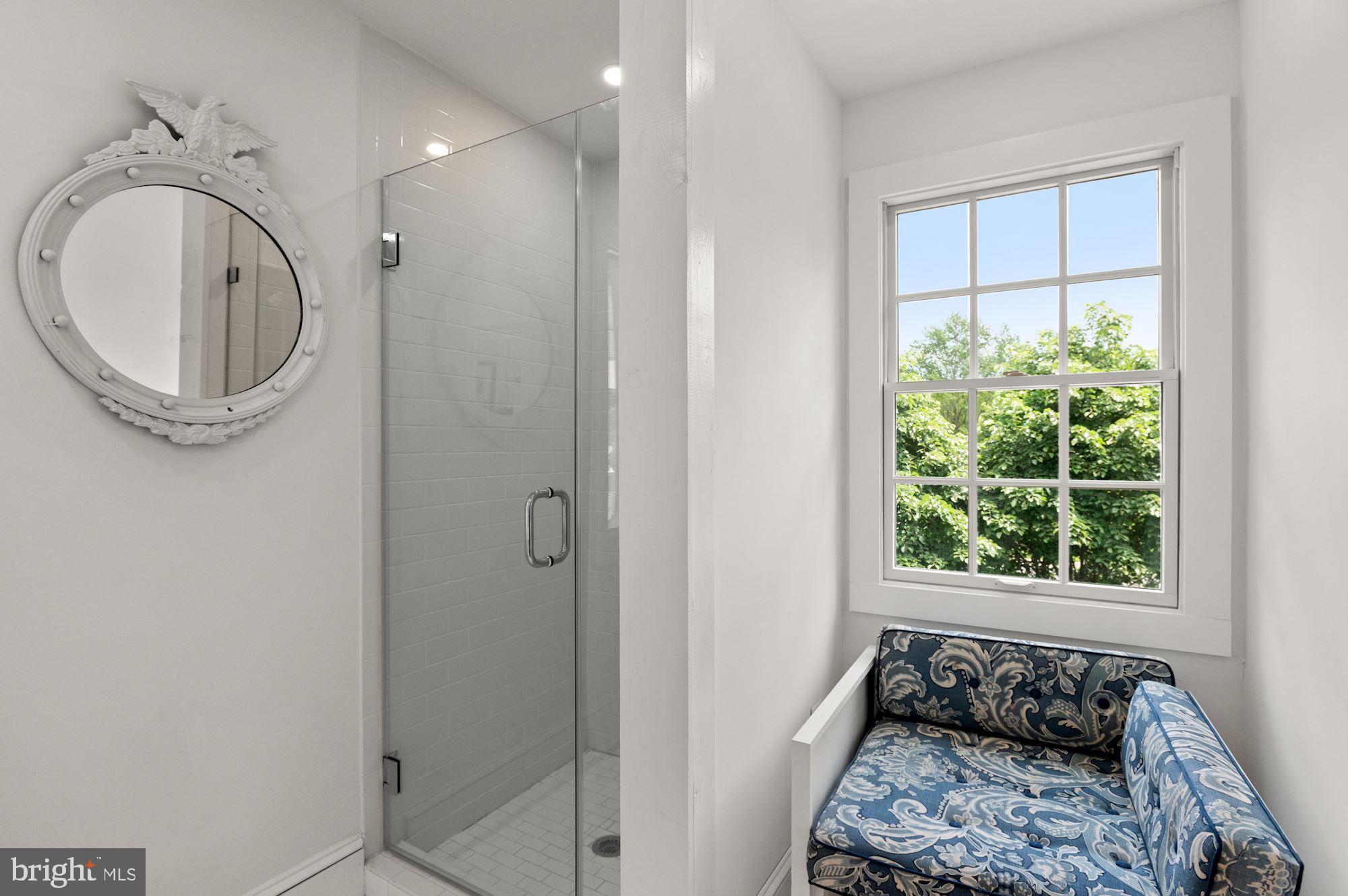 1101 Chain Bridge Road McLean, VA 22101 - Photo 54 of 54 a bathroom with a bathtub and a window