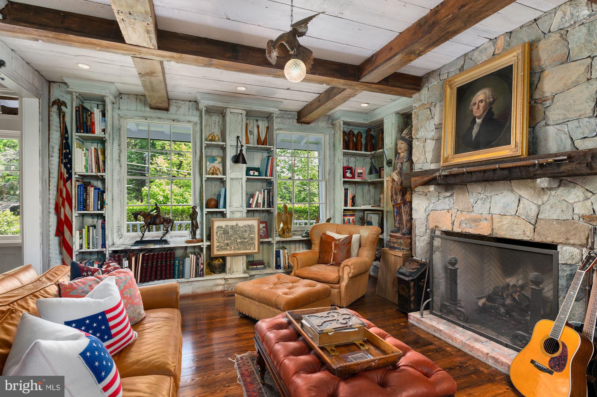 1101 Chain Bridge Road McLean, VA 22101 - Photo 7 of 54 a living room with furniture a fireplace and a window