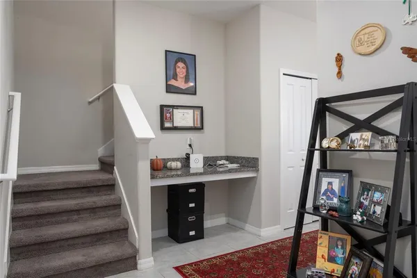 a view of an entryway with wooden floor