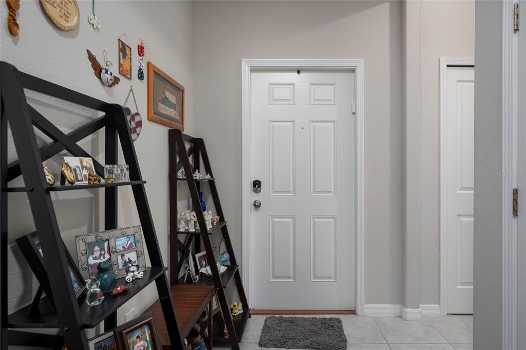 11704 Castine Street New Port Richey, FL 34654 - Photo 12 of 31 a view of an entryway with wooden floor