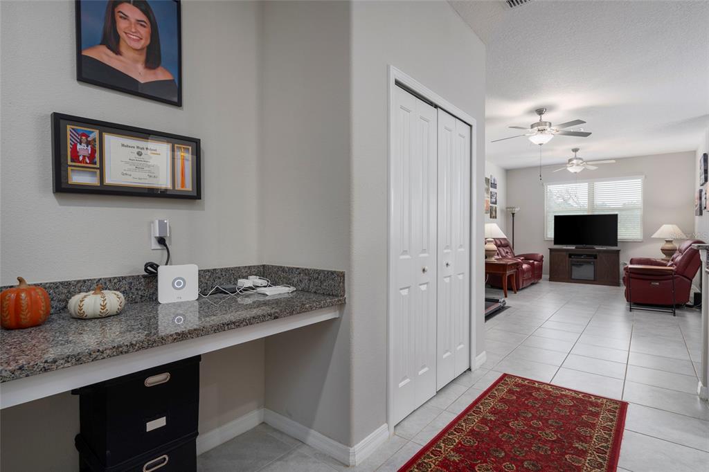 11704 Castine Street New Port Richey, FL 34654 - Photo 13 of 31 a kitchen with sink cabinets and stove