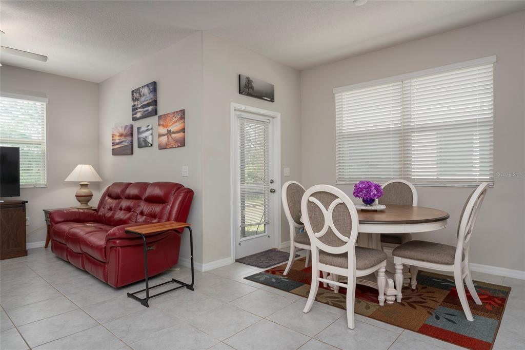 11704 Castine Street New Port Richey, FL 34654 - Photo 15 of 31 a view of a dining room with furniture and a window