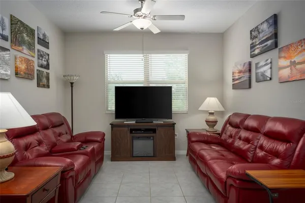 a view of kitchen with refrigerator and chairs