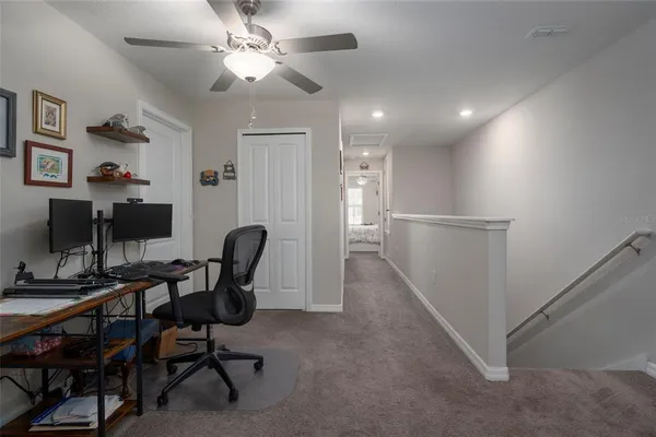 a bedroom with a bed and a dresser in it