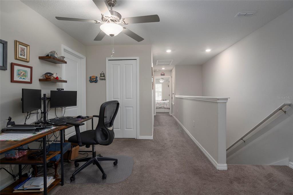 11704 Castine Street New Port Richey, FL 34654 - Photo 22 of 31 a view of a workspace with furniture and a workspace