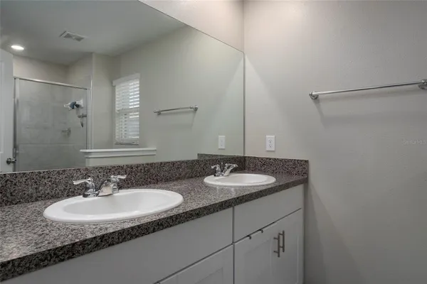 a bathroom with a shower and toilet
