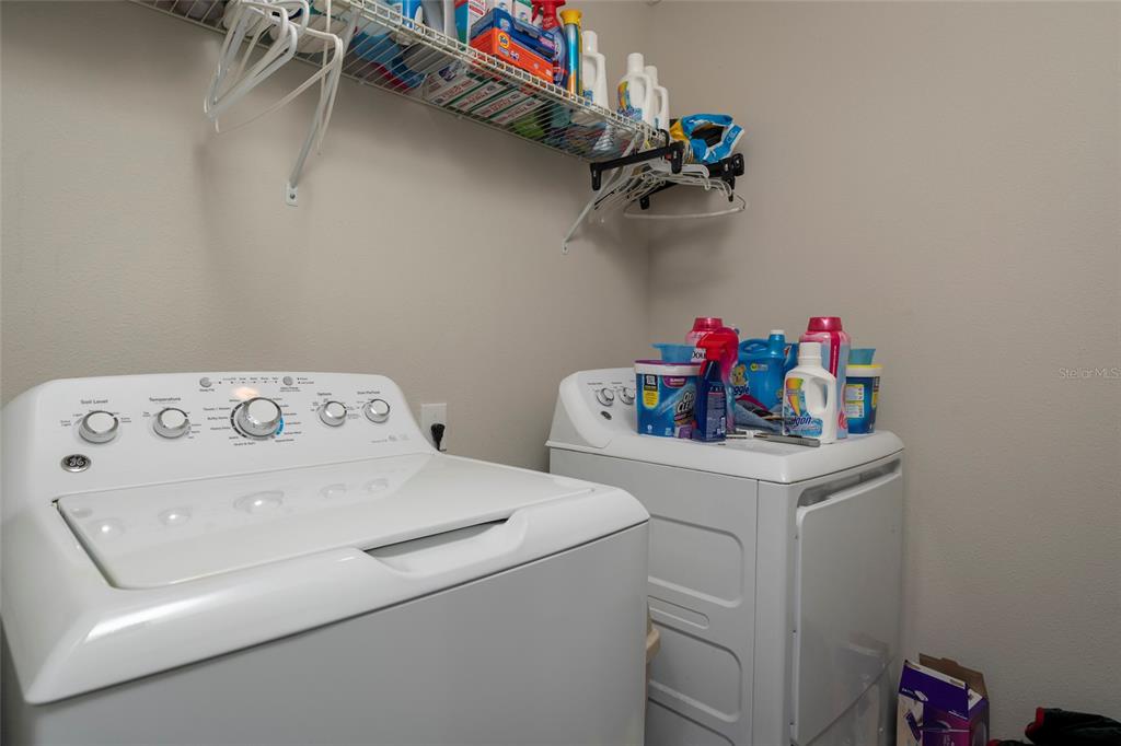 11704 Castine Street New Port Richey, FL 34654 - Photo 27 of 31 a utility room with dryer and washer