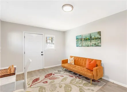 a bedroom with a bed and a couch