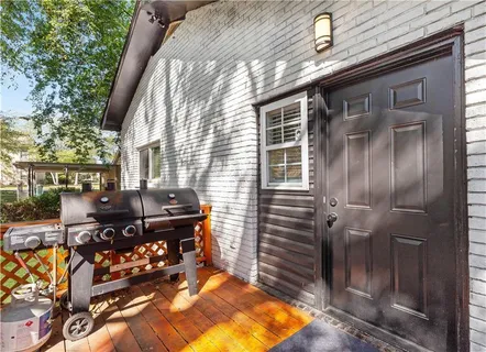 a backyard of a house with outdoor seating