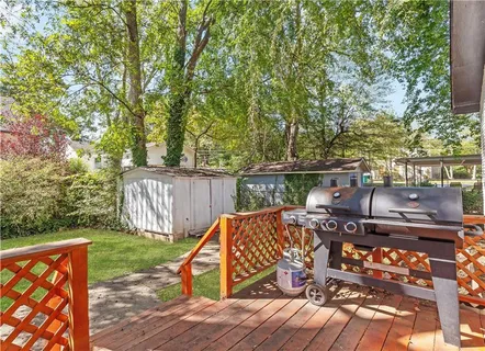 a view of a wooden deck with furniture