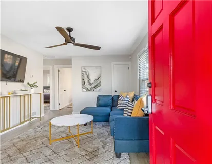 a living room with furniture and a flat screen tv