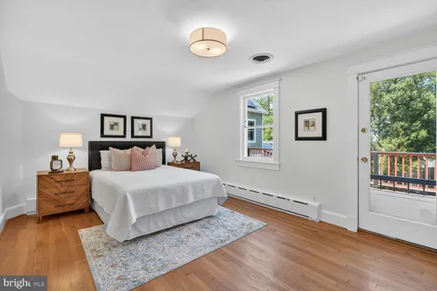 a spacious bedroom with a bed and a couch