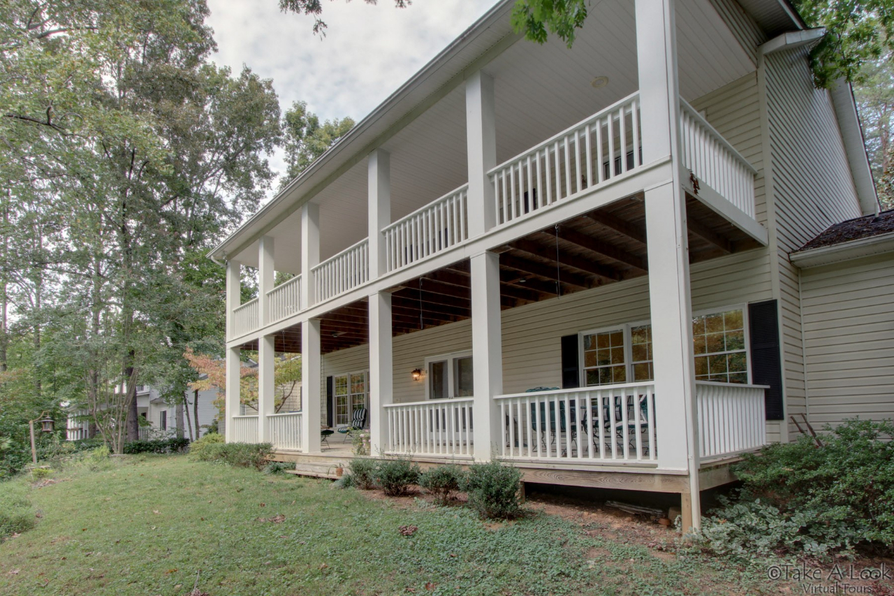 1283 Crosswind Road Goodview, VA 24095 - Photo 2 of 48 a view of a house with a yard and deck