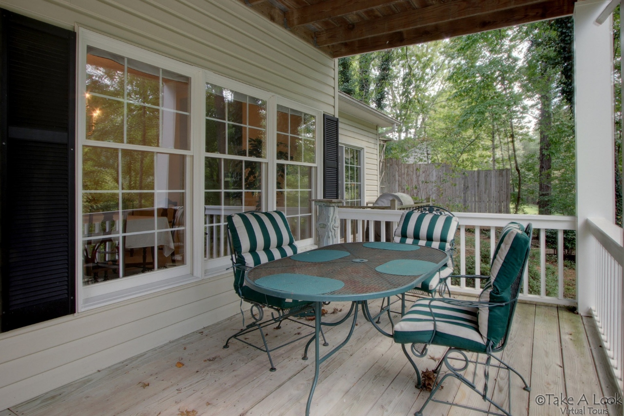 1283 Crosswind Road Goodview, VA 24095 - Photo 13 of 48 a view of a deck with a table and chairs