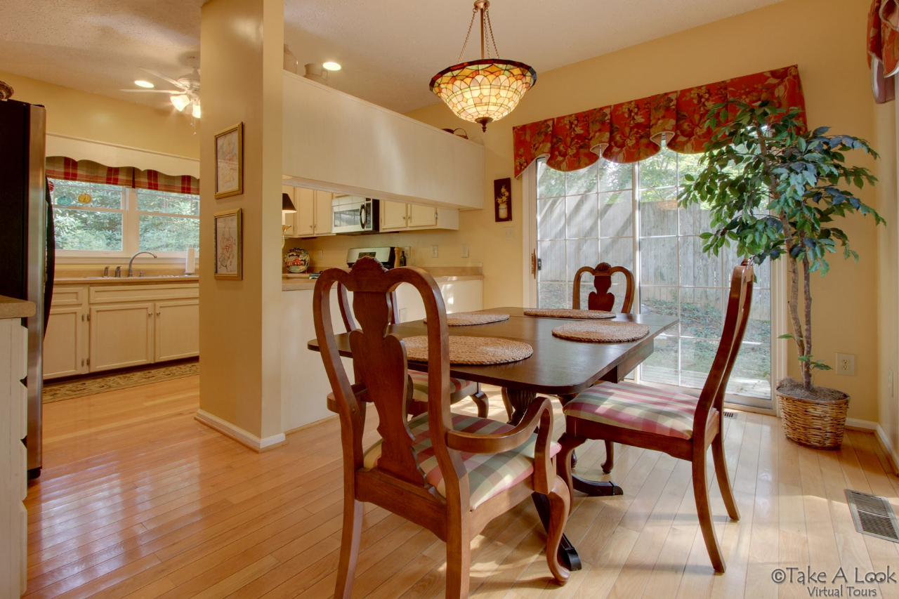 1283 Crosswind Road Goodview, VA 24095 - Photo 18 of 48 a view of a dining room with furniture window and wooden floor
