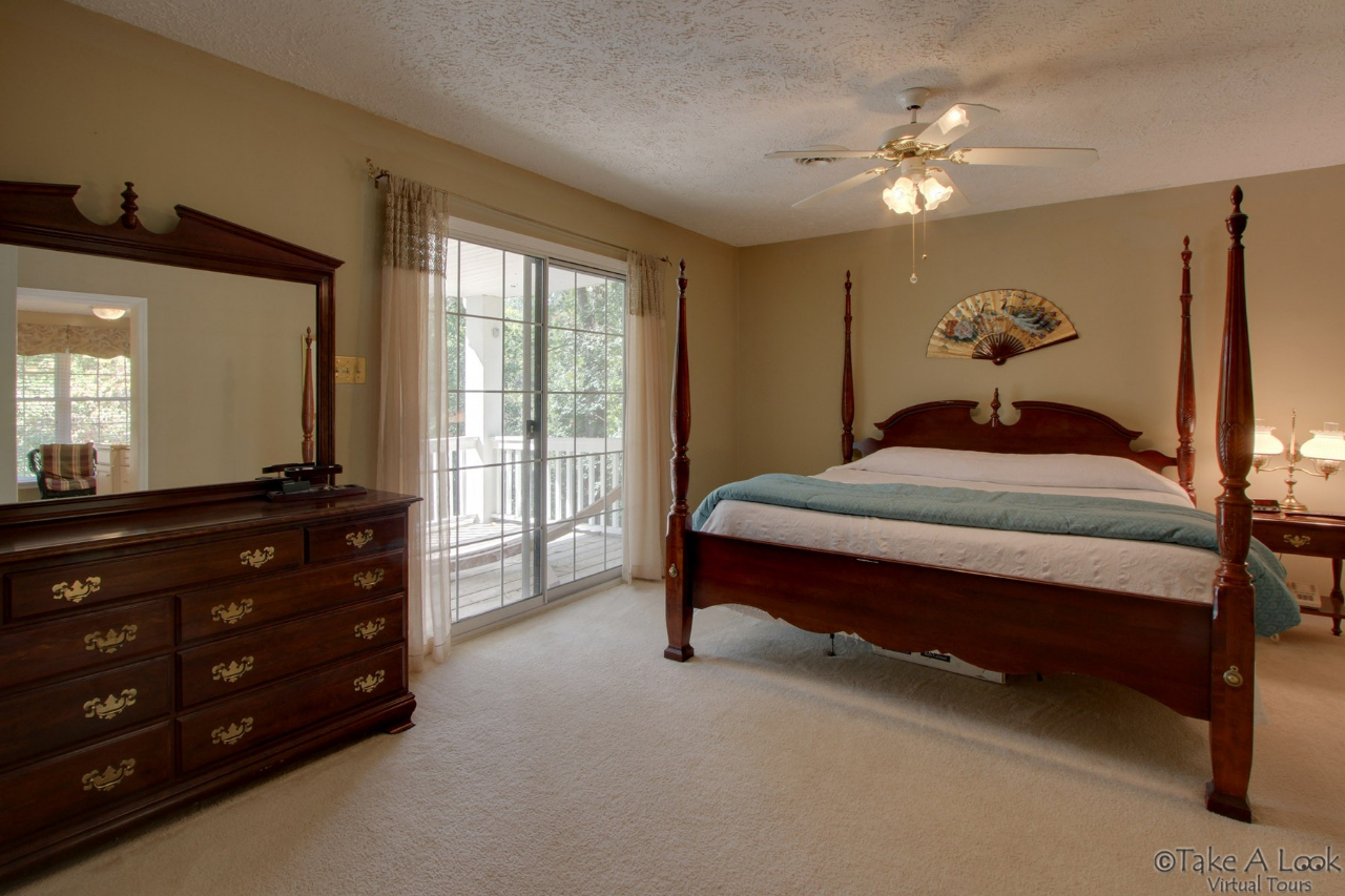 1283 Crosswind Road Goodview, VA 24095 - Photo 23 of 48 a bedroom with a bed and window