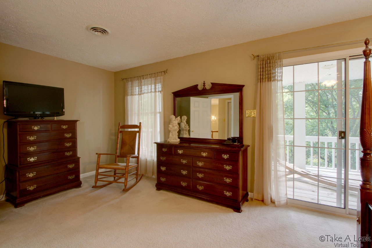 1283 Crosswind Road Goodview, VA 24095 - Photo 24 of 48 a room with a dresser and a flat screen tv