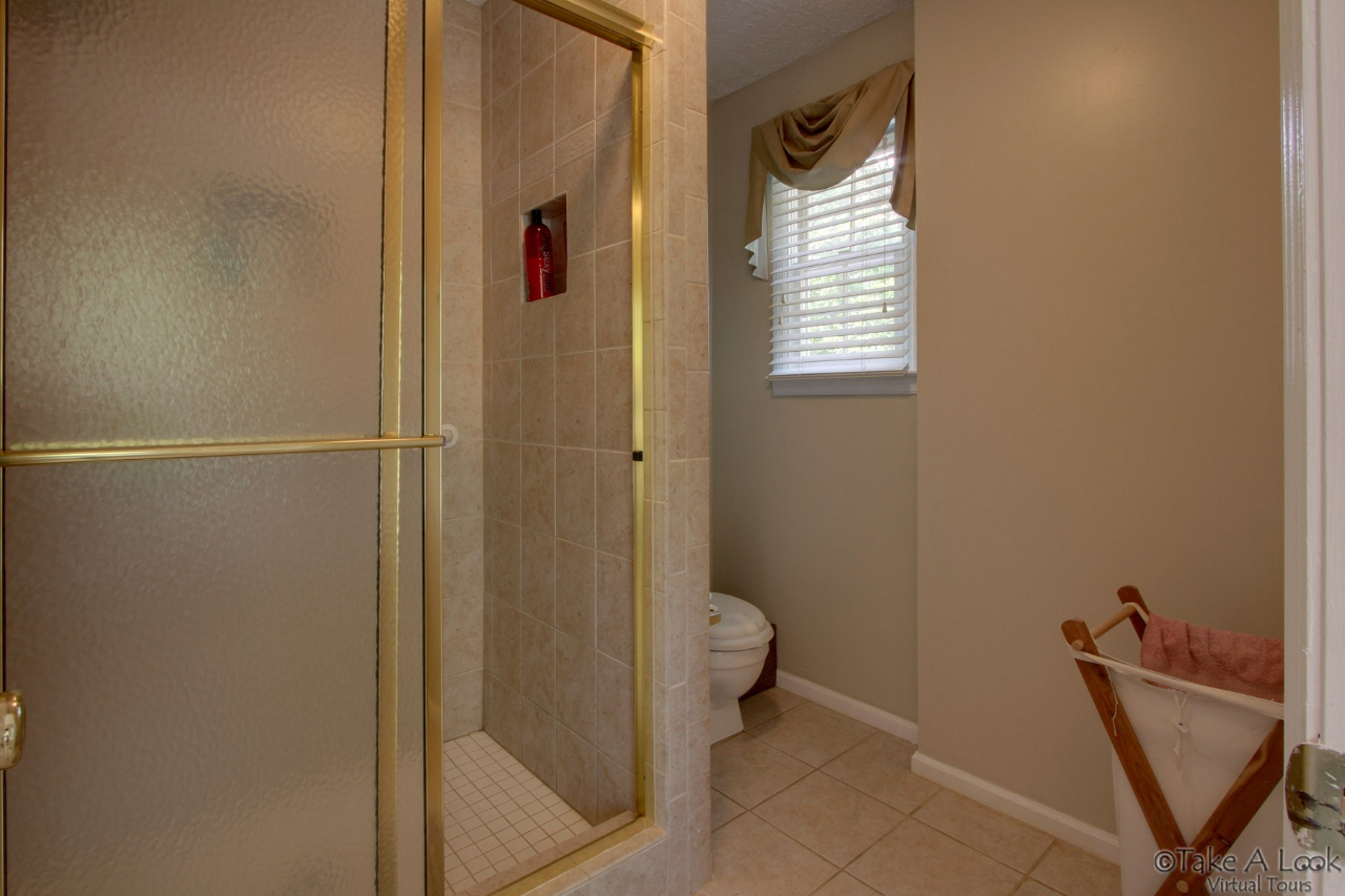 1283 Crosswind Road Goodview, VA 24095 - Photo 26 of 48 a bathroom with a toilet and a shower