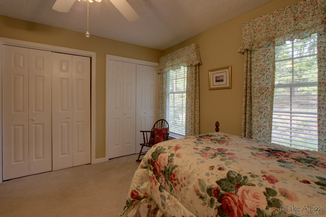 1283 Crosswind Road Goodview, VA 24095 - Photo 32 of 48 a bedroom with a bed and a window