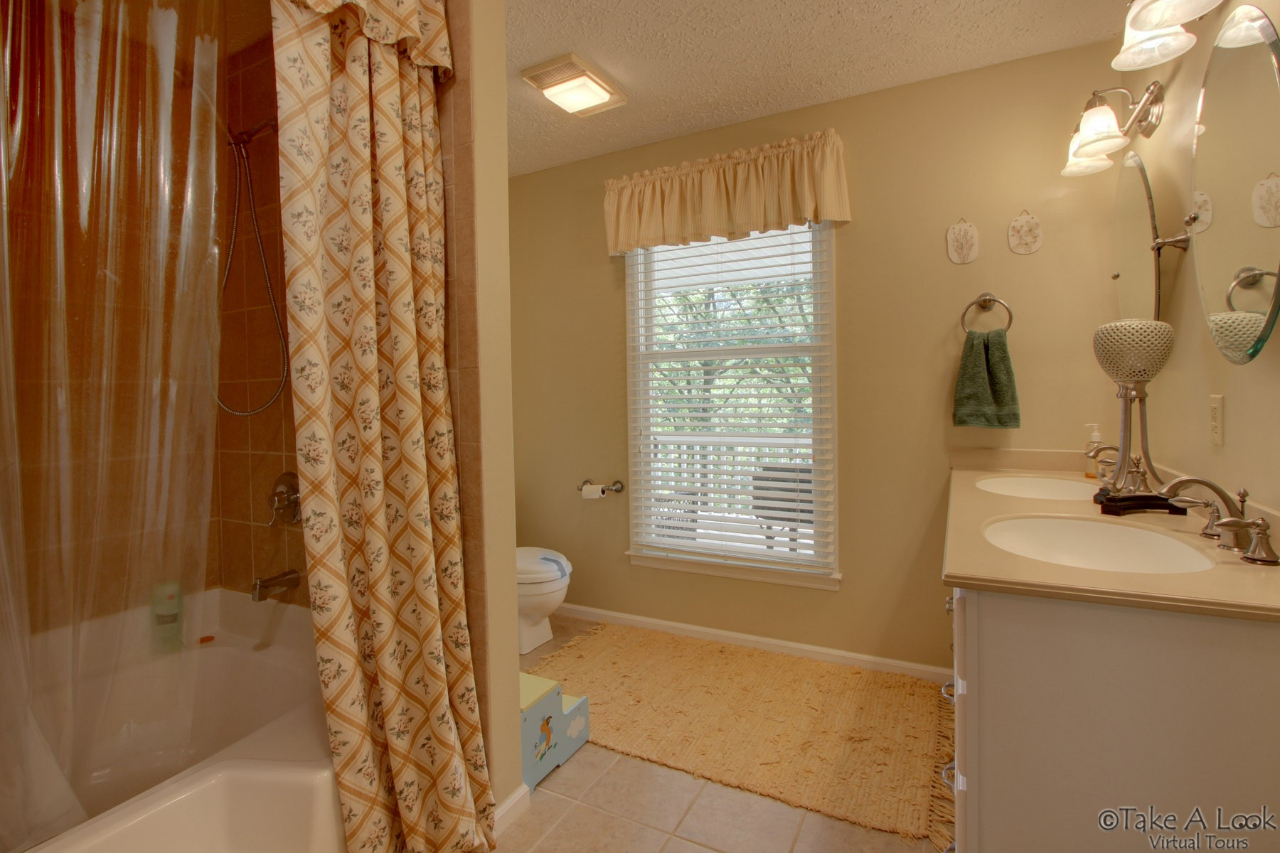1283 Crosswind Road Goodview, VA 24095 - Photo 33 of 48 a bathroom with a sink a toilet and shower