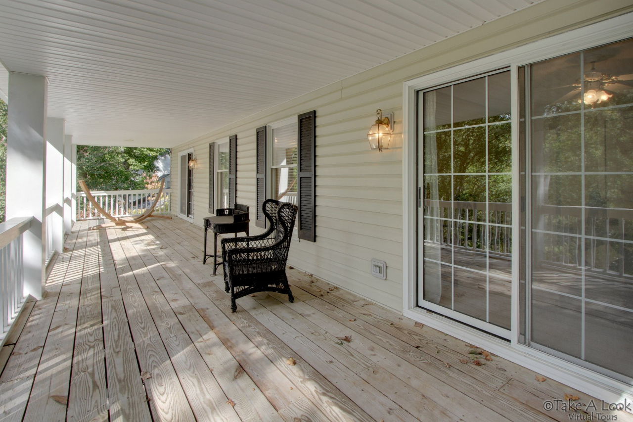 1283 Crosswind Road Goodview, VA 24095 - Photo 35 of 48 a swimming pool with outdoor seating and yard