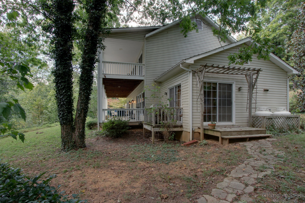 1283 Crosswind Road Goodview, VA 24095 - Photo 37 of 48 a front view of a house with garden