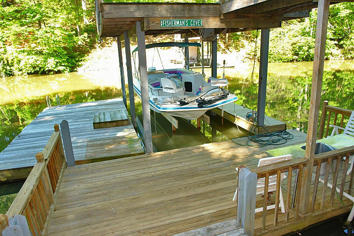 1283 Crosswind Road Goodview, VA 24095 - Photo 41 of 48 a balcony with wooden floor and outdoor seating