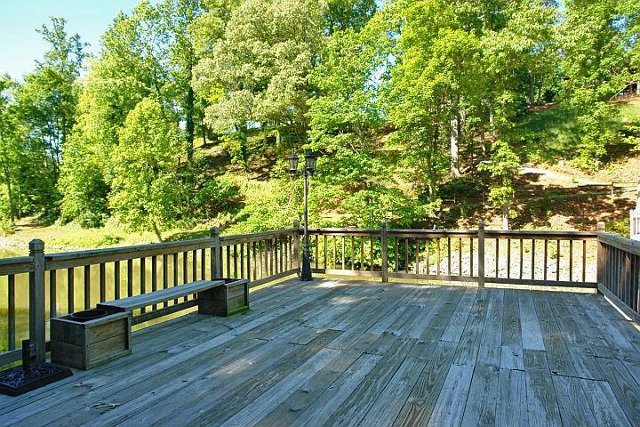 1283 Crosswind Road Goodview, VA 24095 - Photo 45 of 48 a balcony with wooden floor and fence