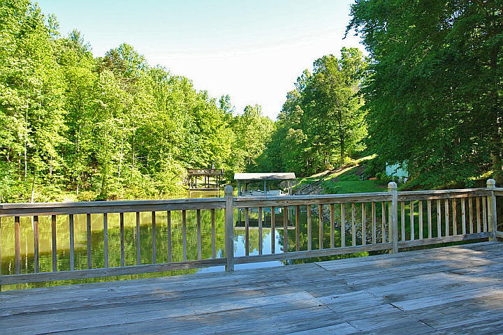 1283 Crosswind Road Goodview, VA 24095 - Photo 46 of 48 a balcony with wooden floor and fence