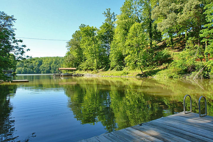 1283 Crosswind Road Goodview, VA 24095 - Photo 47 of 48 a view of a lake with a yard