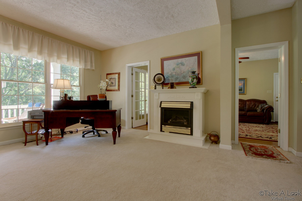 1283 Crosswind Road Goodview, VA 24095 - Photo 8 of 48 a living room with furniture and a fireplace