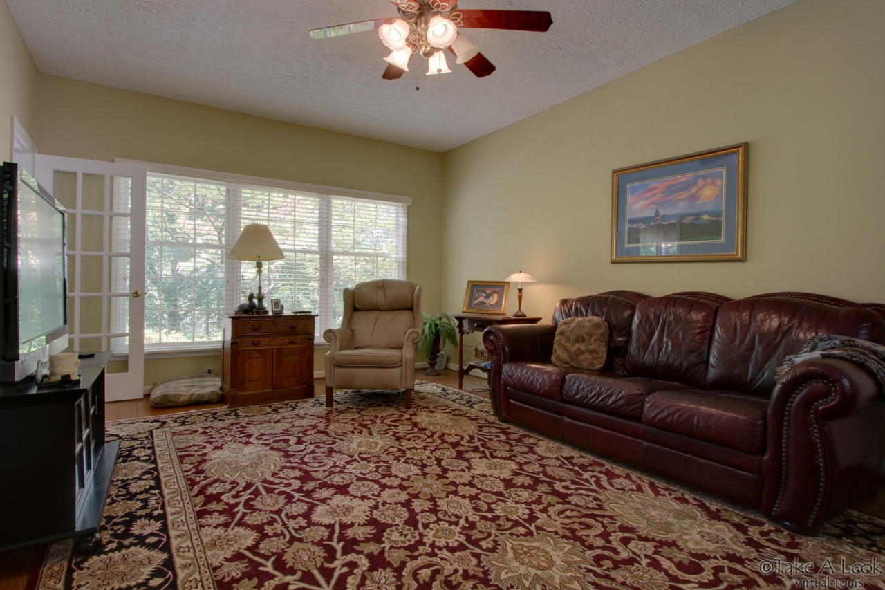 1283 Crosswind Road Goodview, VA 24095 - Photo 9 of 48 a living room with furniture and a flat screen tv