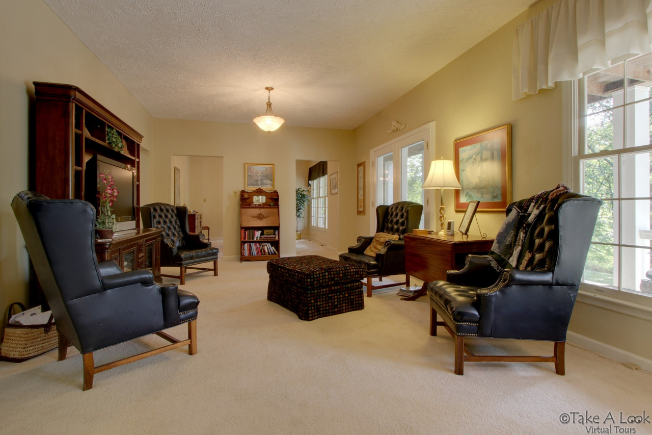 1283 Crosswind Road Goodview, VA 24095 - Photo 10 of 48 a living room with furniture and a piano
