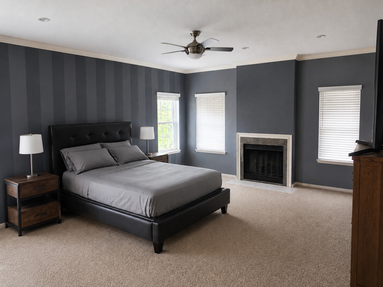 6000 Reims Road, Unit 3601 Houston, TX 77036 - Photo 7 of 13 a spacious bedroom with a bed and a fireplace