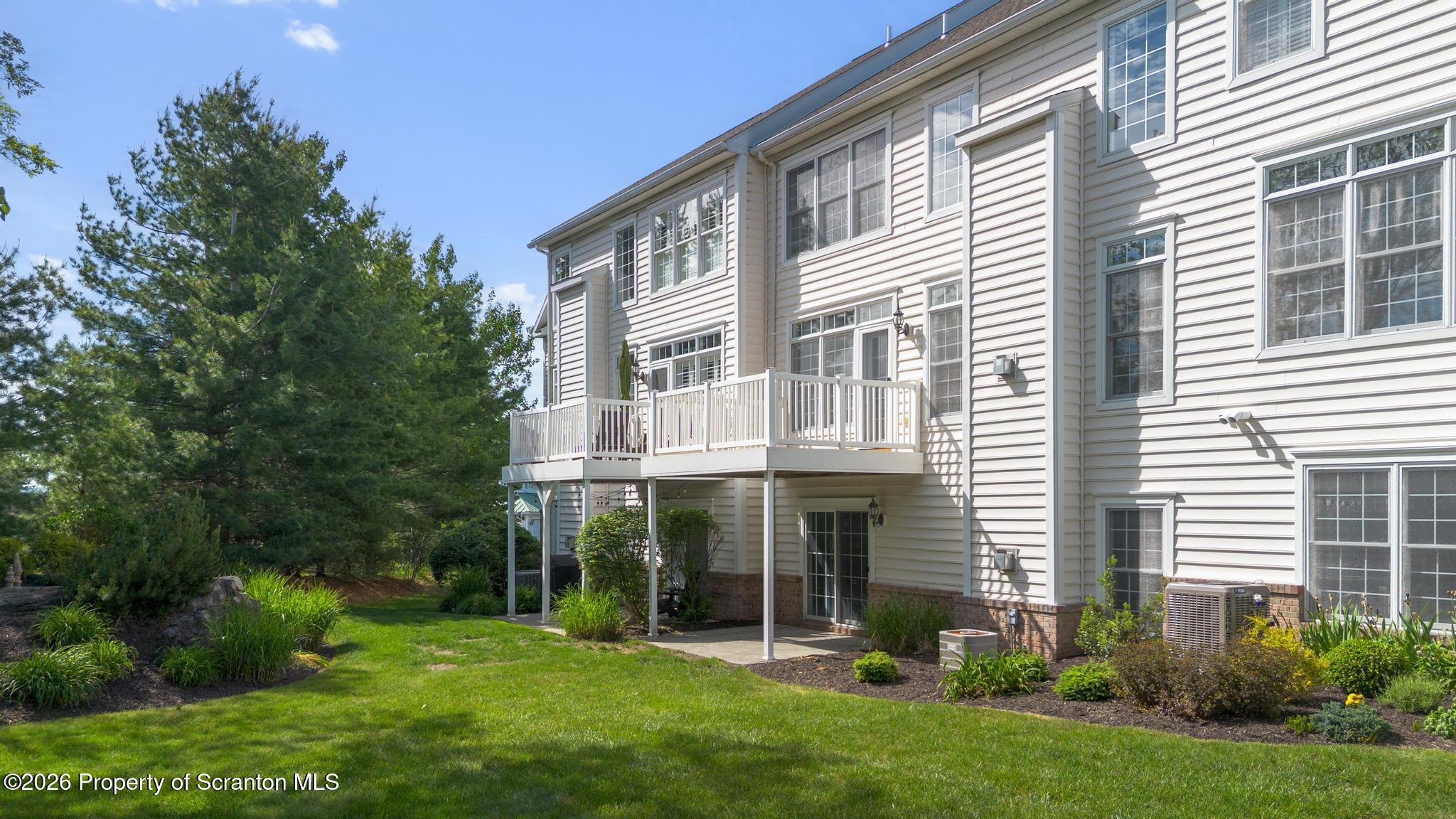 1502 Verne Cl Moosic, PA 18507 - Photo 2 of 46 a view of an house with backyard porch and garden