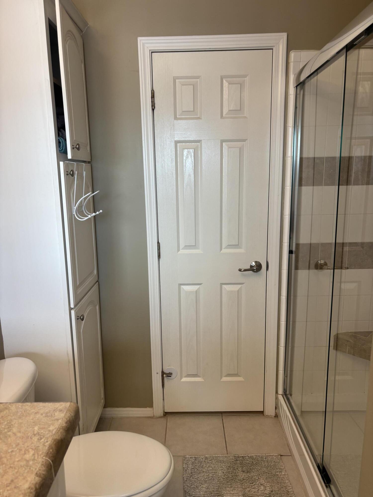 210 West 2nd Court Key Largo, FL 33037 - Photo 12 of 30 a bathroom with a toilet and a shower