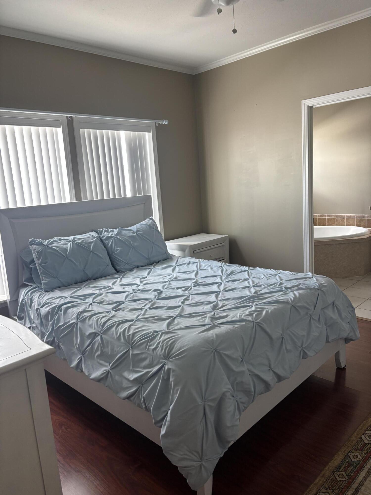 210 West 2nd Court Key Largo, FL 33037 - Photo 14 of 30 a bedroom with a bed and window