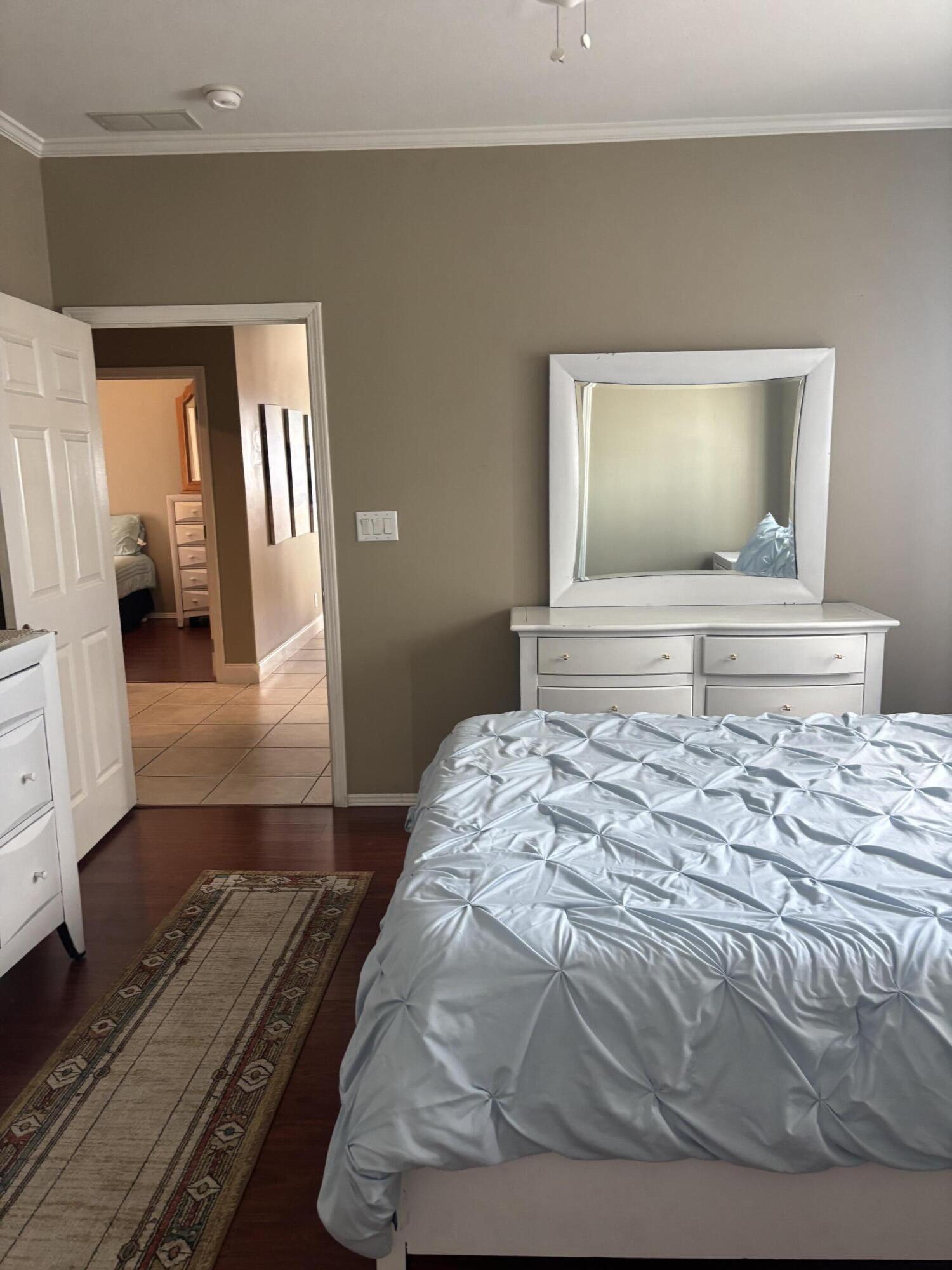 210 West 2nd Court Key Largo, FL 33037 - Photo 15 of 30 a bedroom with a bed and a mirror