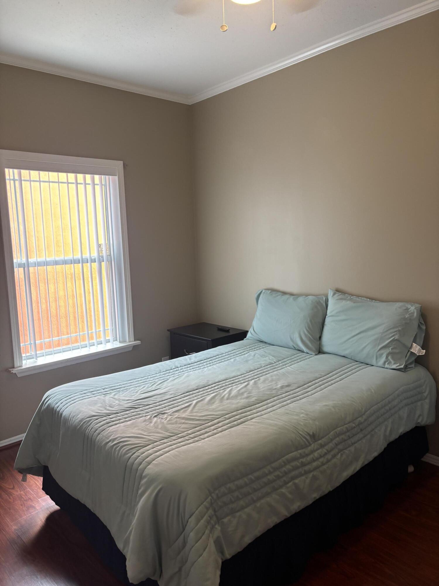 210 West 2nd Court Key Largo, FL 33037 - Photo 19 of 30 a bedroom with a bed and window