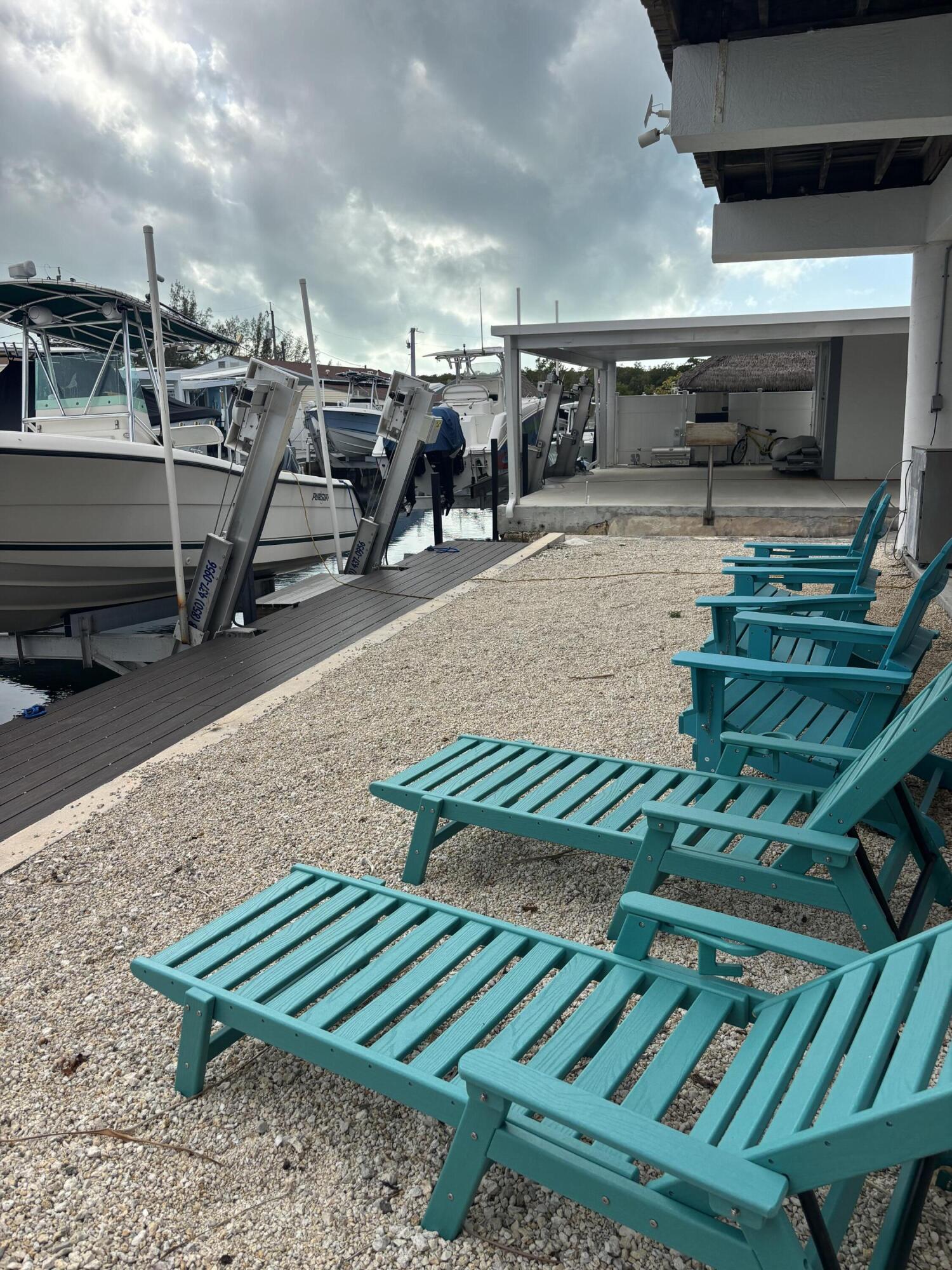 210 West 2nd Court Key Largo, FL 33037 - Photo 25 of 30 a view of a chairs in a patio