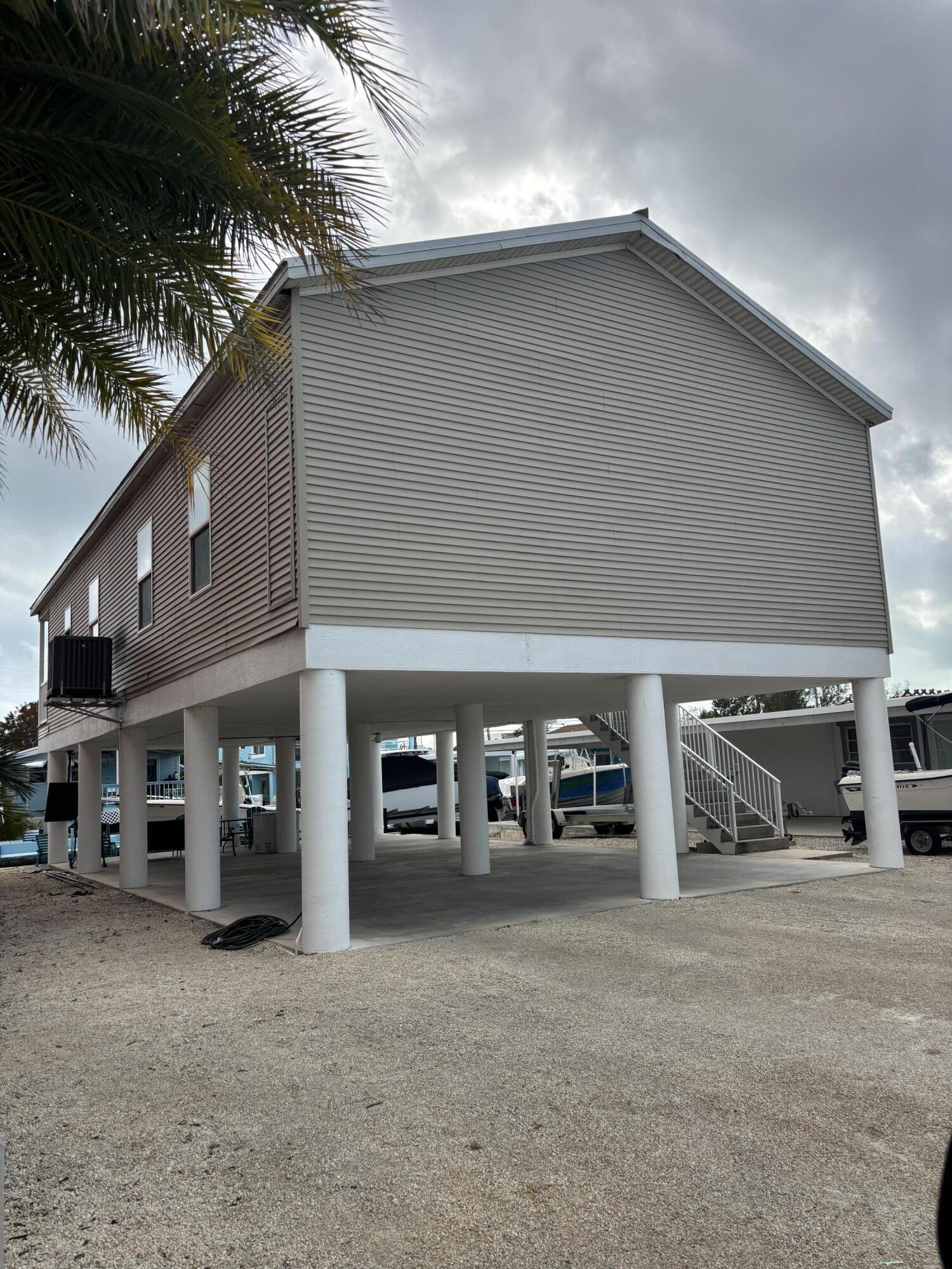 210 West 2nd Court Key Largo, FL 33037 - Photo 26 of 30 front view of a building with a street view