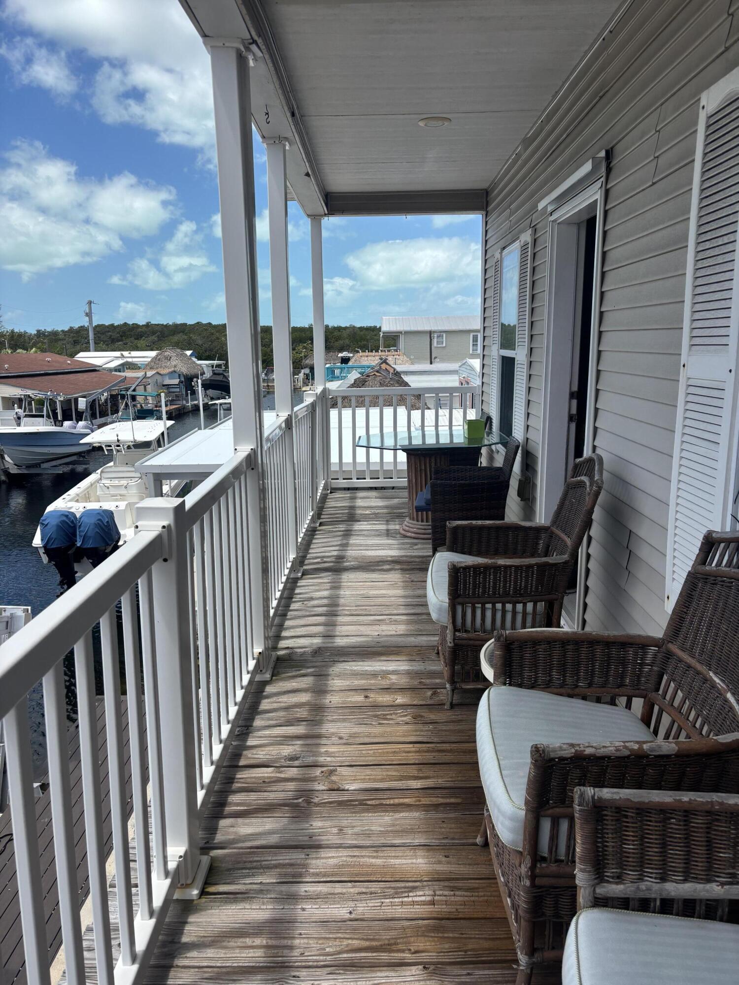 210 West 2nd Court Key Largo, FL 33037 - Photo 3 of 30 a view of balcony with wooden floor