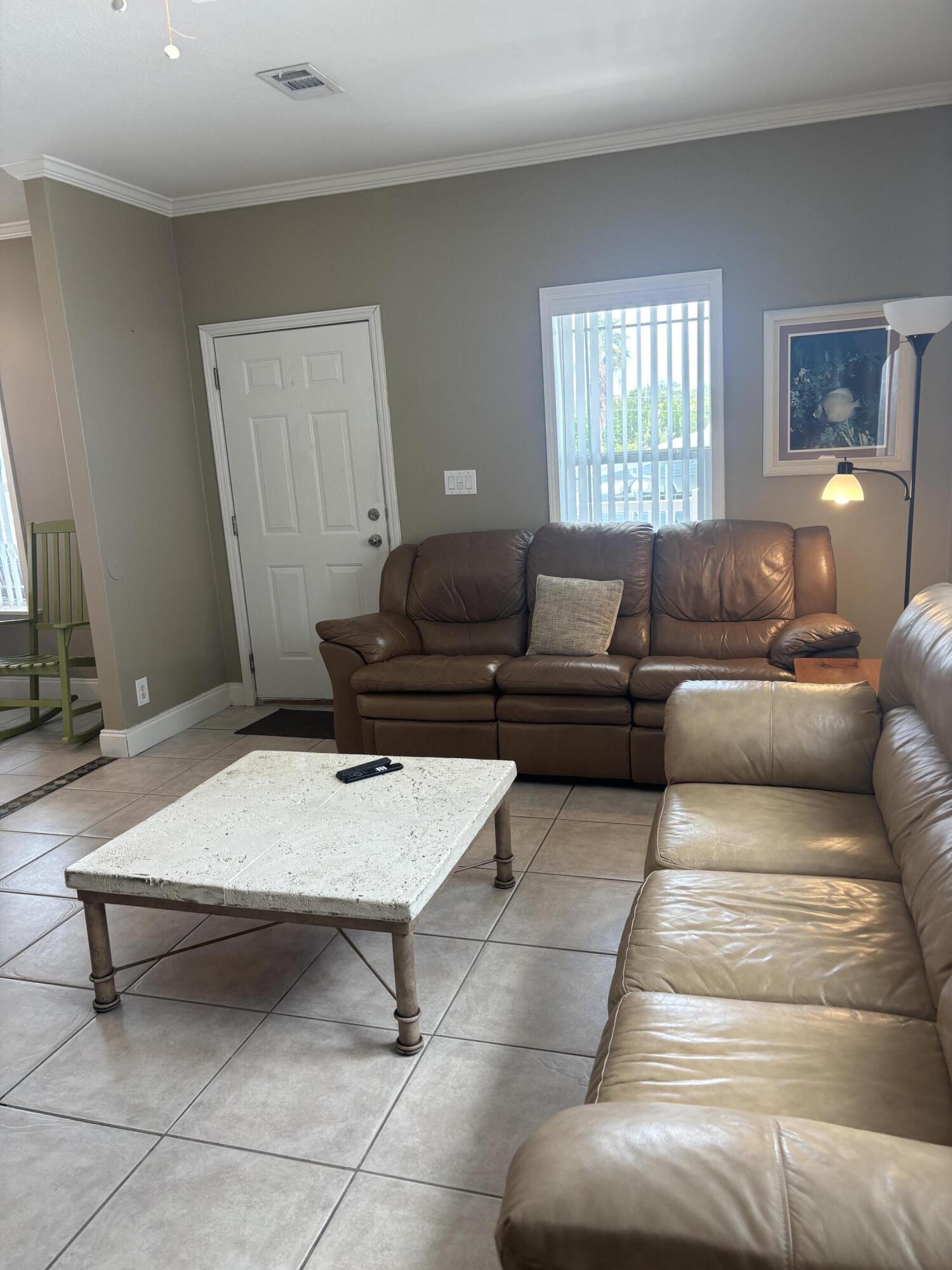 210 West 2nd Court Key Largo, FL 33037 - Photo 6 of 30 a living room with furniture and a window