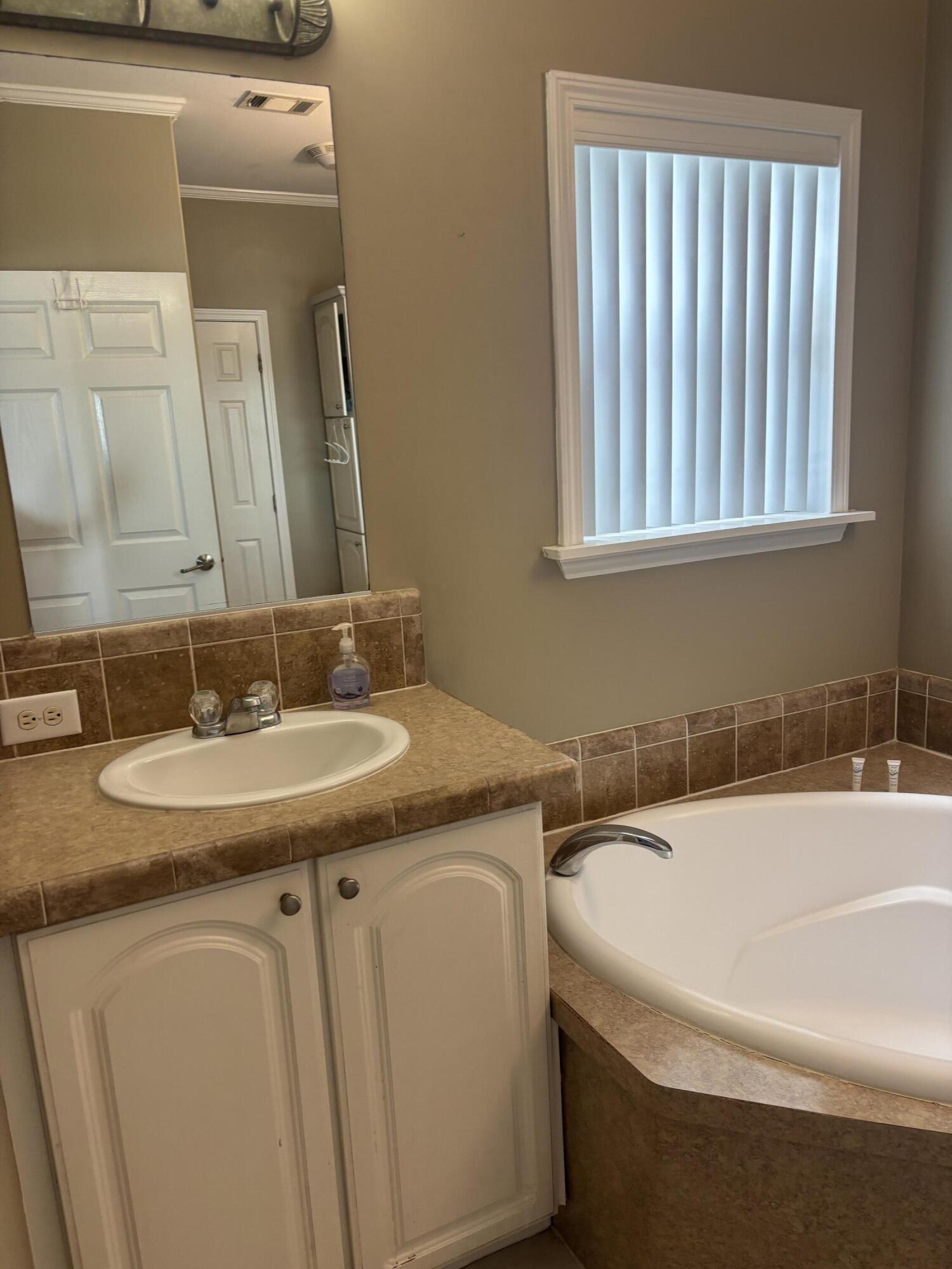 210 West 2nd Court Key Largo, FL 33037 - Photo 10 of 30 a bathroom with a sink and a mirror