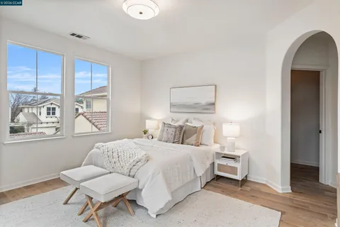 a bathroom with a double vanity sink mirror and toilet