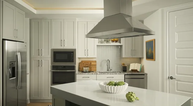 a kitchen with stainless steel appliances granite countertop a sink and refrigerator